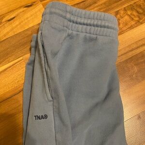 TNA blue sweat pants size medium